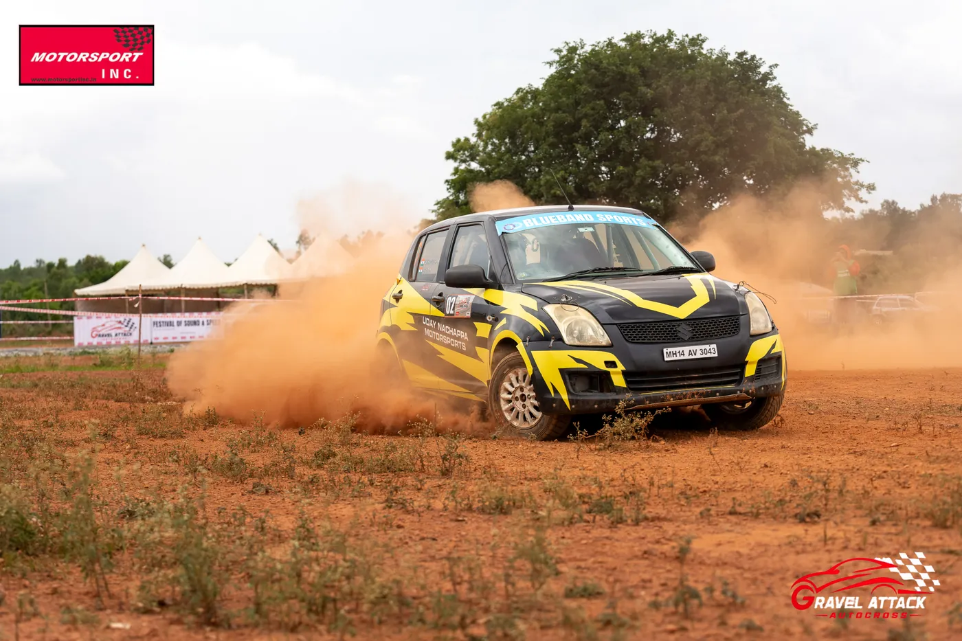 Rally car throwing a huge dust plume at Gravel Attack