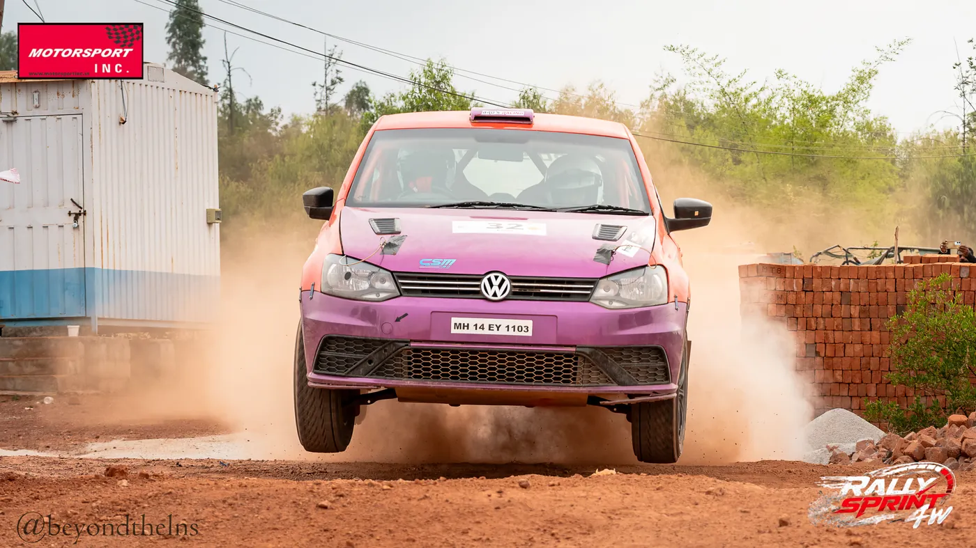 Rally car head-on through a wall of dust at Rally Sprint 4W