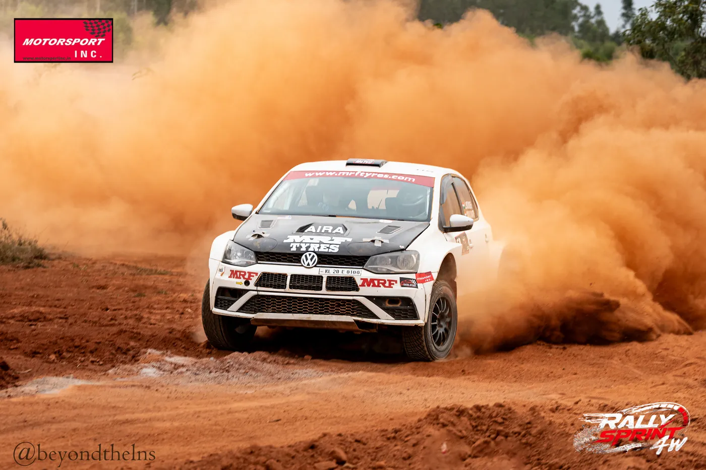 Rally car sliding wide in a dust cloud at Rally Sprint 4W