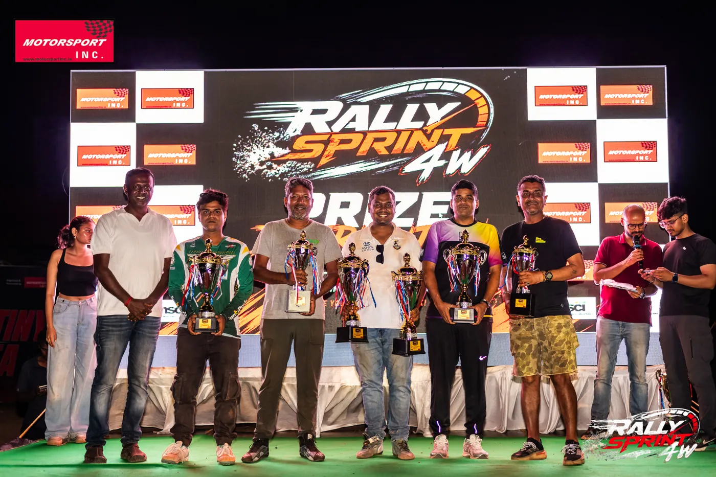 Class winners raising their trophies at Rally Sprint 4W